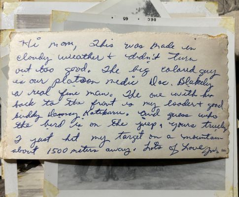 His writing on the back of the photo to his parents  Press Enter to Activate this item.