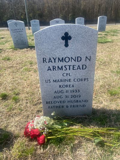Armstead's grave with the inscription, "beloved husband, father, and friend."