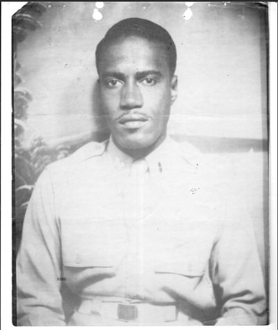 A young African American man wearing an Army uniform.