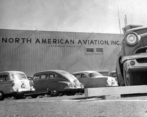 Photograph of a building with a sign labeled, North American Aviation, Inc.