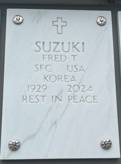 Fred Suzuki's niche marker with the phrase, "rest in peace."