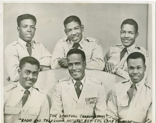 Six African American men pose in uniform.